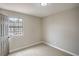 Bright bedroom with neutral walls, carpet and a window with natural light at 5757 Charles Holden Ct, Las Vegas, NV 89103