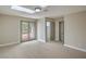 Neutral bedroom with large patio doors, neutral carpet, and closet at 5757 Charles Holden Ct, Las Vegas, NV 89103