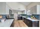 Modern kitchen with stainless steel appliances, updated backsplash, and quartz countertops at 5757 Charles Holden Ct, Las Vegas, NV 89103