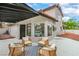 Covered patio area features comfortable seating, perfect for outdoor relaxation and entertaining at 5757 Charles Holden Ct, Las Vegas, NV 89103
