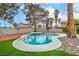 Beautiful kidney-shaped pool with a small waterfall feature, surrounded by a well-maintained backyard at 5757 Charles Holden Ct, Las Vegas, NV 89103