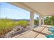 Covered balcony with seating, fireplace and a view at 6315 Bellisima St, Las Vegas, NV 89118