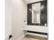 Modern powder room featuring a floating marble vanity, sleek faucet, and unique vertical tile at 6315 Bellisima St, Las Vegas, NV 89118