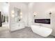 This bright bathroom features a soaking tub, dual sink vanity, and a modern design at 6315 Bellisima St, Las Vegas, NV 89118