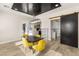 Dining area features a herringbone ceiling, black accent door, and seating for four at 6315 Bellisima St, Las Vegas, NV 89118