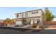 Beautiful two-story home with desert landscaping and a two-car garage on a sunny day at 6315 Bellisima St, Las Vegas, NV 89118