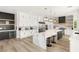 Modern kitchen featuring a central island, stainless steel appliances, and custom cabinetry at 6315 Bellisima St, Las Vegas, NV 89118