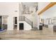 Spacious living room with a staircase, stylish doors, and an open floor plan at 6315 Bellisima St, Las Vegas, NV 89118