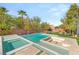 Backyard featuring a pool, lounge chairs, grass and desert landscaping at 6315 Bellisima St, Las Vegas, NV 89118