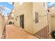 A cozy backyard with a brick patio and space for outdoor furniture and a grill at 6488 Bentley Wood Ct, Las Vegas, NV 89130