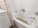 Bathroom with shower/tub combo and white tile at 6488 Bentley Wood Ct, Las Vegas, NV 89130