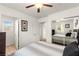 Bedroom with a window, ceiling fan and mirrored closet door for added space at 6488 Bentley Wood Ct, Las Vegas, NV 89130