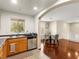 Open dining area features hardwood floors, natural light, and leads into the kitchen and living space at 6488 Bentley Wood Ct, Las Vegas, NV 89130