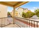 Balcony view overlooking the exterior buildings, street, and landscape of this community at 6488 Bentley Wood Ct, Las Vegas, NV 89130