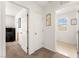 Carpeted hallway with access to bedrooms and bathrooms on the upper level at 6488 Bentley Wood Ct, Las Vegas, NV 89130