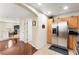 Modern kitchen flowing into the living area, showcasing stainless steel appliances at 6488 Bentley Wood Ct, Las Vegas, NV 89130