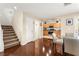 Open living space features a dining area, kitchen, and access to the stairwell at 6488 Bentley Wood Ct, Las Vegas, NV 89130