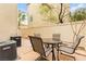 Inviting patio area with a table and chairs, perfect for enjoying outdoor living at 6488 Bentley Wood Ct, Las Vegas, NV 89130