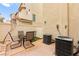 Cozy patio area with table and chairs, perfect for outdoor dining and relaxation at 6488 Bentley Wood Ct, Las Vegas, NV 89130