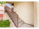 Stairway leading to the front door of a townhome with iron railing at 6488 Bentley Wood Ct, Las Vegas, NV 89130