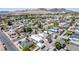 Aerial view of neighborhood featuring single Gathering homes, tree lined streets, and mountain view at 663 D Ave, Boulder City, NV 89005
