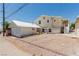 Exterior of a house featuring a detached garage with gravel landscaping at 663 D Ave, Boulder City, NV 89005