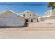 Exterior of a house featuring a detached garage and minimal gravel landscaping at 663 D Ave, Boulder City, NV 89005