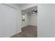 A neutral carpeted bedroom with a closet, ceiling fan, and an AC unit at 663 D Ave, Boulder City, NV 89005
