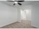 Bright bedroom featuring neutral carpet, ceiling fan, and ample natural light at 663 D Ave, Boulder City, NV 89005