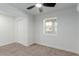 Bedroom with neutral carpet, ceiling fan, closet, and natural light at 663 D Ave, Boulder City, NV 89005