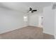 Bright bedroom with neutral carpet, ceiling fan and AC unit at 663 D Ave, Boulder City, NV 89005