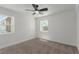 Bedroom with neutral carpet, ceiling fan, natural light at 663 D Ave, Boulder City, NV 89005