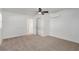 The carpeted bedroom offers a neutral color scheme, a ceiling fan, and an AC unit at 663 D Ave, Boulder City, NV 89005