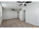 Spacious carpeted bedroom with ceiling fans and ample natural light at 663 D Ave, Boulder City, NV 89005