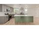 Newly updated kitchen featuring a stylish kitchen island and stainless steel appliances at 663 D Ave, Boulder City, NV 89005