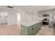 Bright kitchen features a large island with seating and modern appliances at 663 D Ave, Boulder City, NV 89005