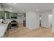 Open-concept kitchen features modern finishes and wood flooring at 663 D Ave, Boulder City, NV 89005