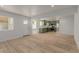 Open-concept living room and kitchen with modern finishes and wood flooring at 663 D Ave, Boulder City, NV 89005