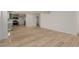 Open-concept living room and kitchen with modern finishes and wood flooring at 663 D Ave, Boulder City, NV 89005
