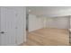 Bright living room featuring wood floors, recessed lighting, and fresh white walls at 663 D Ave, Boulder City, NV 89005