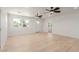 Open-concept living space with new flooring, abundant natural light, and modern ceiling fans at 663 D Ave, Boulder City, NV 89005