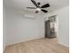 Spacious living area featuring light wood floors, and stainless-steel refrigerator at 663 D Ave, Boulder City, NV 89005