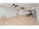Expansive living area with an eat-in kitchen, light wood floors, and neutral color palette at 663 D Ave, Boulder City, NV 89005