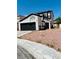 Two-story home featuring a spacious two-car garage and low maintenance desert landscaping at 6640 Crosstimber Ct, Las Vegas, NV 89108
