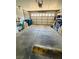 Spacious two-car garage with ample storage space and concrete flooring at 6640 Crosstimber Ct, Las Vegas, NV 89108