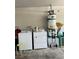 Garage with washer, dryer, and hot water heater at 6640 Crosstimber Ct, Las Vegas, NV 89108