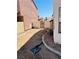 Side yard with dirt landscaping and block wall at 6640 Crosstimber Ct, Las Vegas, NV 89108
