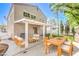 Inviting backyard patio area with covered pergola, modern outdoor furniture, and lush landscaping at 6649 Maple Mesa St, North Las Vegas, NV 89084