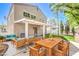 Inviting backyard patio area with covered pergola, modern outdoor furniture, and lush landscaping at 6649 Maple Mesa St, North Las Vegas, NV 89084
