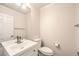 Bathroom features a white vanity, mirror and toilet at 6649 Maple Mesa St, North Las Vegas, NV 89084